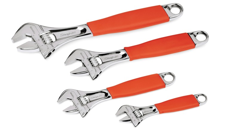 four Snap-On Adjustable Wrenches with orange handle