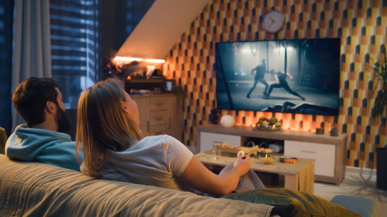 Couple sitting and watching TV