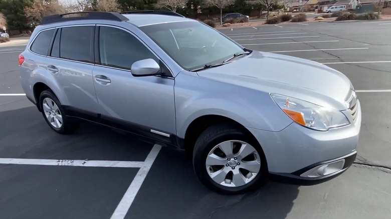 Silver 2012 Subaru Outback in a parking lot