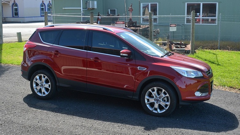 Maroon 2015 Ford Escape in the sun