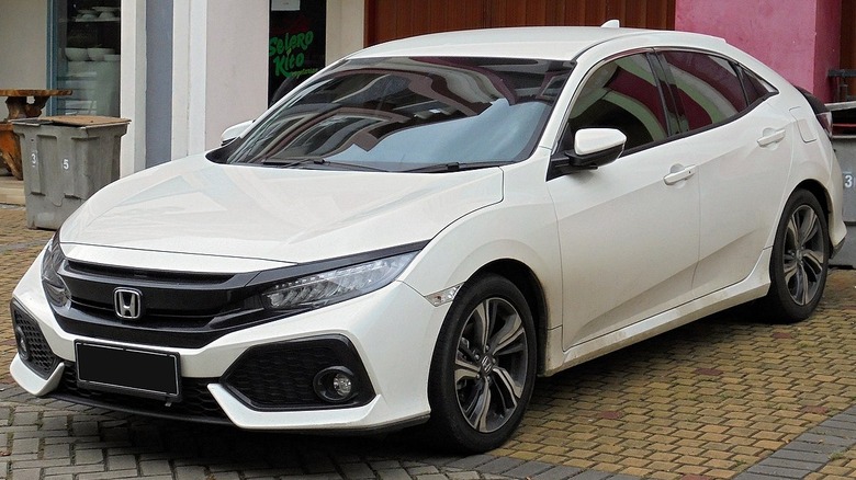 White 2018 Honda Civic on a brick street