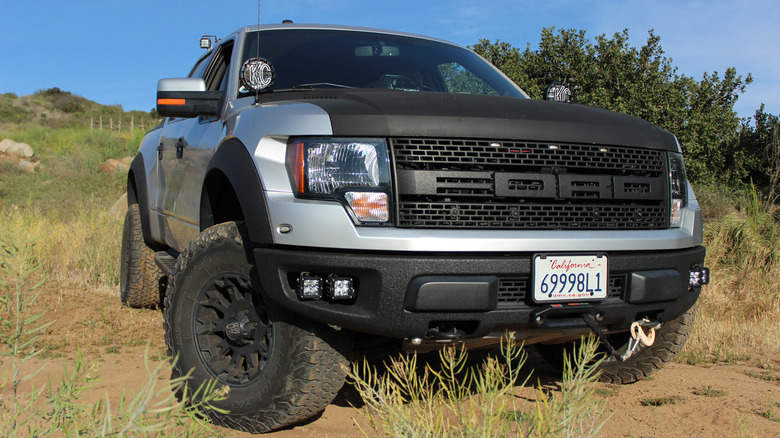 A Ford F-150 pickup truck on a dirt road