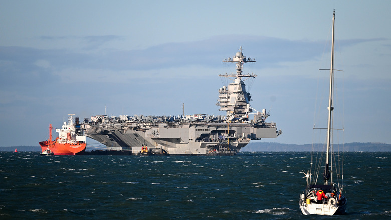 USS Gerald R. Ford with yacht