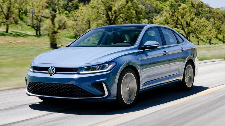 Blue 2025 Volkswagen Jetta driving on road