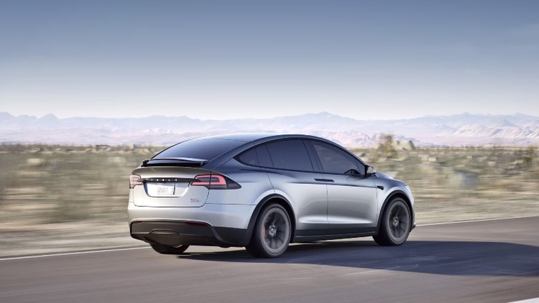 Tesla Model X driving on road