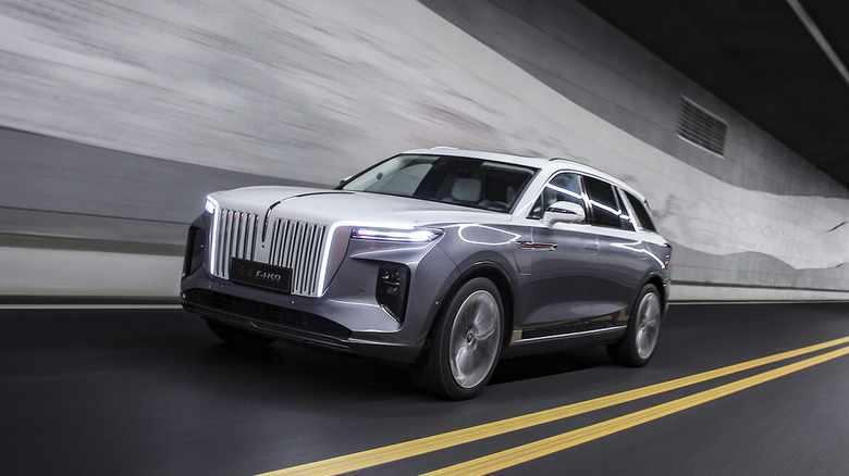 Hongqi E-HS9 luxury electric SUV driving at speed in a tunnel