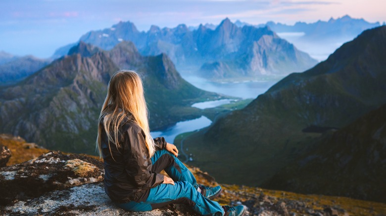 A solo traveler enjoying the landscapes of Norway.