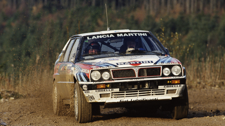 A Lancia Delta HF Integrale shredding a rally stage, front view