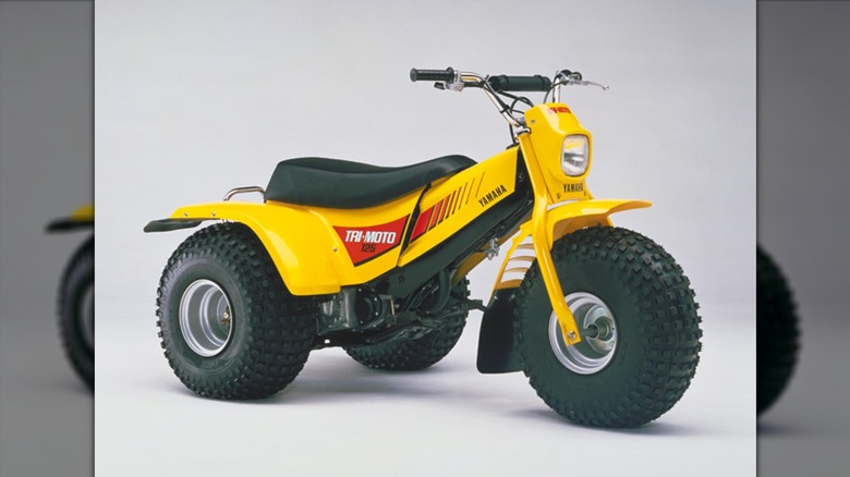 Yellow Yamaha Tri-Moto YT125 on display