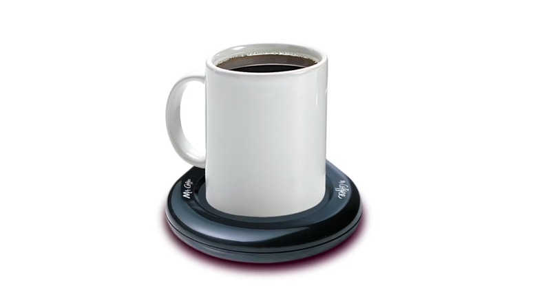 A mug of coffee resting on the Mr. Coffee Mug Warmer.