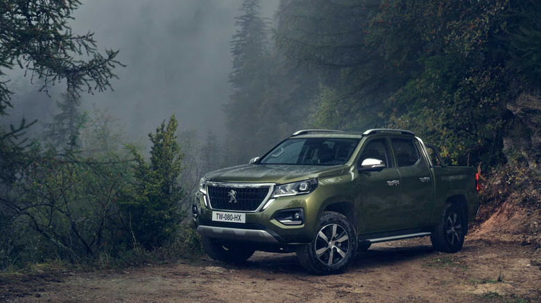 2024 Green Peugeot Landtrek parked in the woods