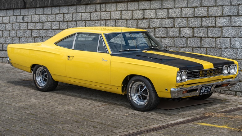 A Plymouth Road Runner in yellow with black stripes