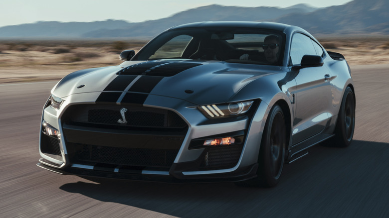 A gray Shelby GT500 in the desert