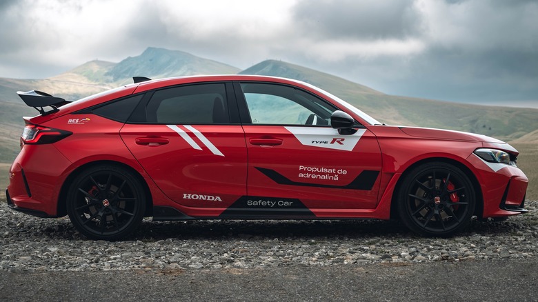 Red Honda Civic Type R on gravel path