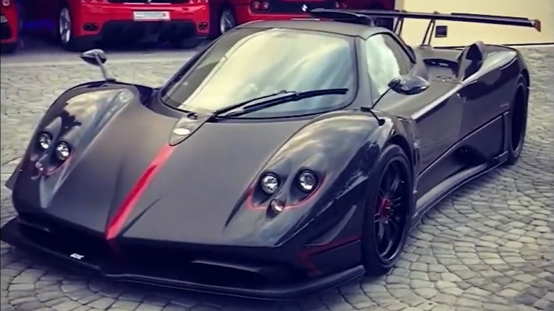 A Zonda 760 Aether Roadster on a brick street