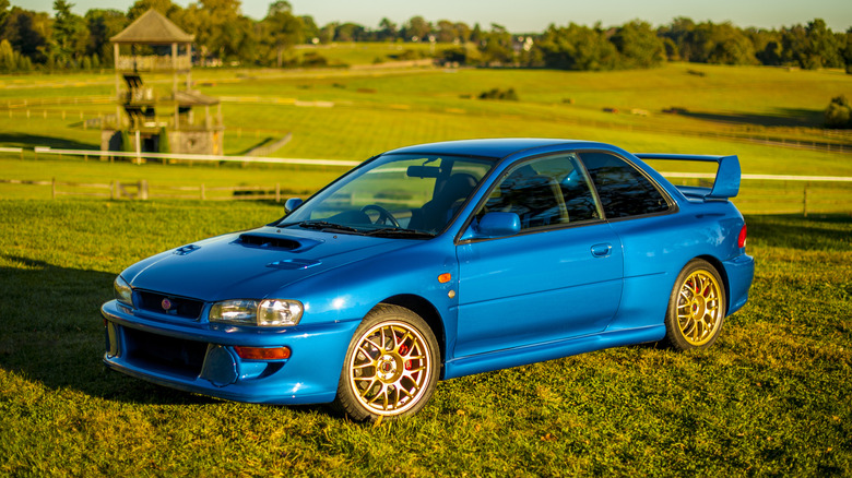 1998 Subaru Impreza 22B STi parked on meadow front 3/4 view