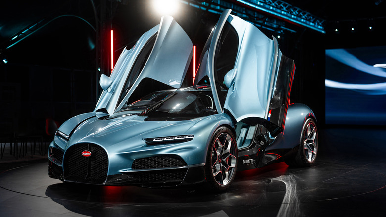 Bugatti Tourbillon hybrid V16 hypercar on stage with open doors