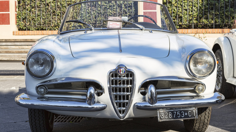 A classic white Alfa Romeo Giulietta Spider.