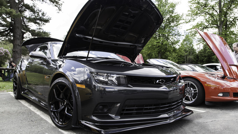 Black Camaro Z/28 parked with hood open