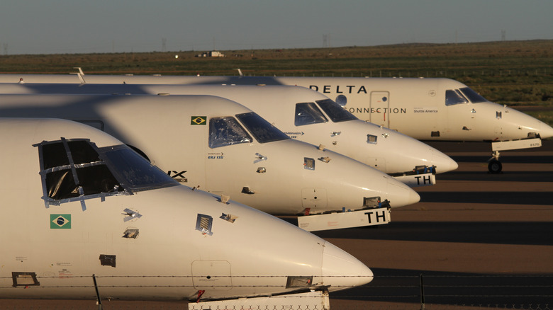 Cockpits of four aircraft parked in a row