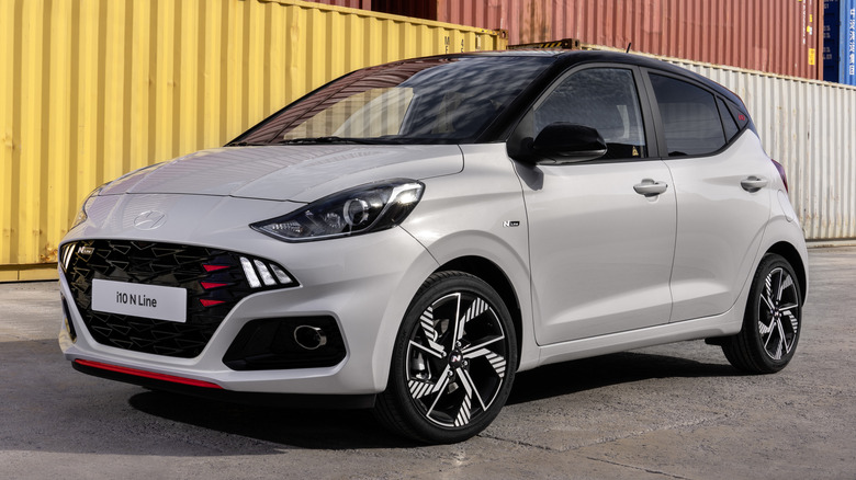 Gray Hyundai i10 N-Line parked on concrete near shipping containers