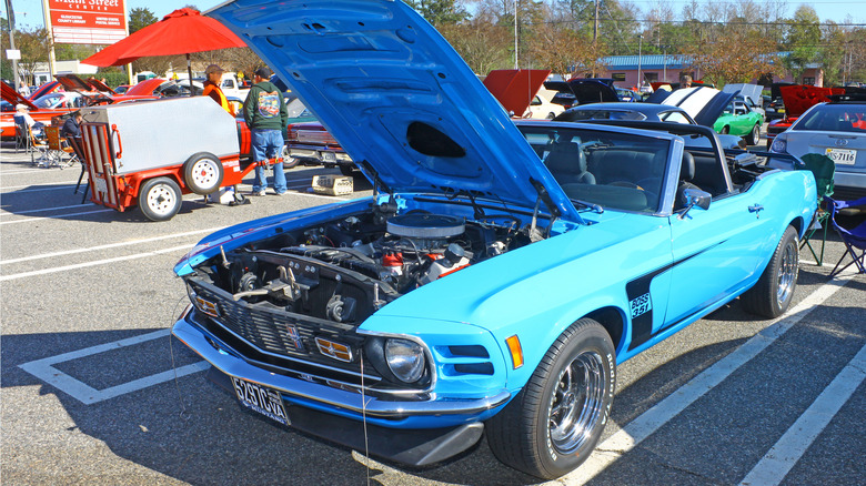 A blue Ford Mustang 351 in a parking lot