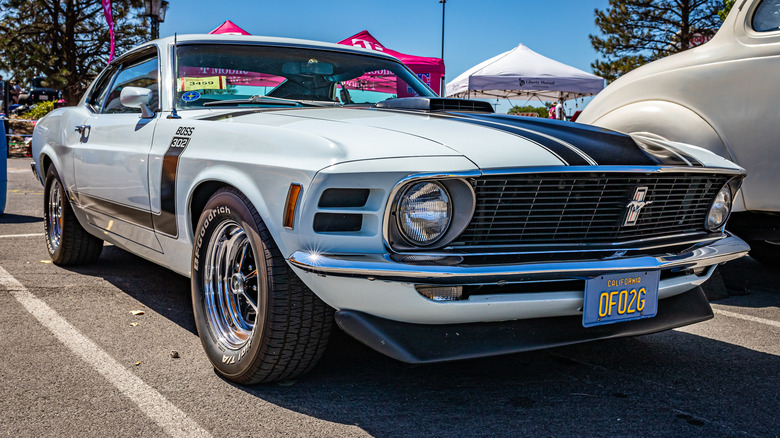 A gray 1970 Ford Mustang Boss 302 at a car show