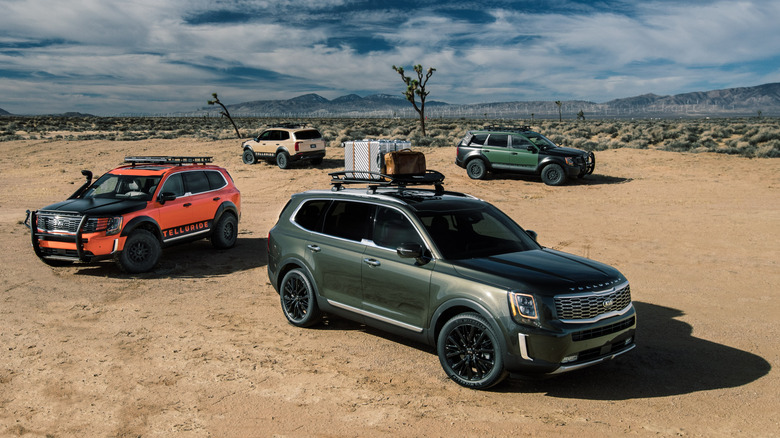 Four Kia Tellurides parked in desert