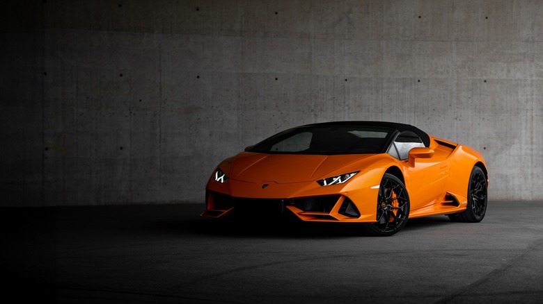 A Lamborghini Huracan EVO Spyder in orange, front 3/4 view