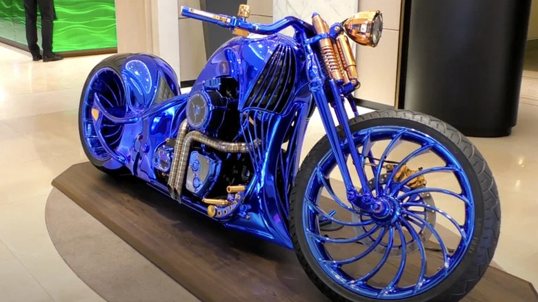 A Harley-Davidson Bucherer Blue parked by a wall