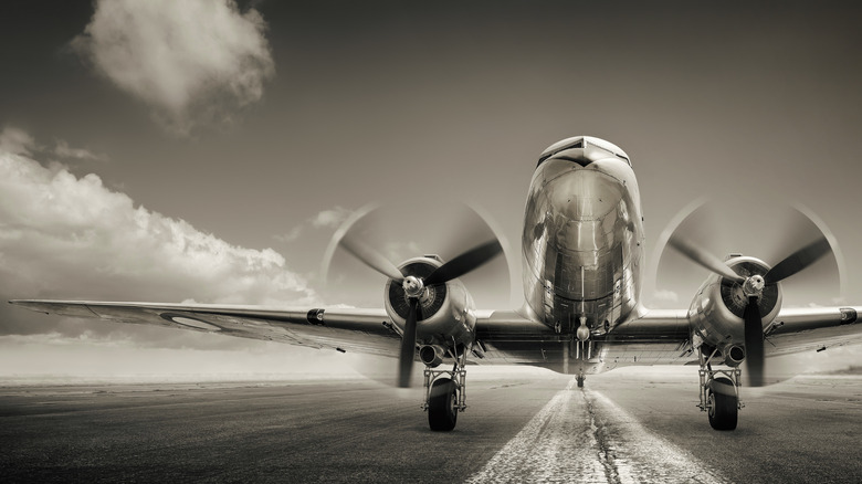 Silver aircraft preparing for takeoff