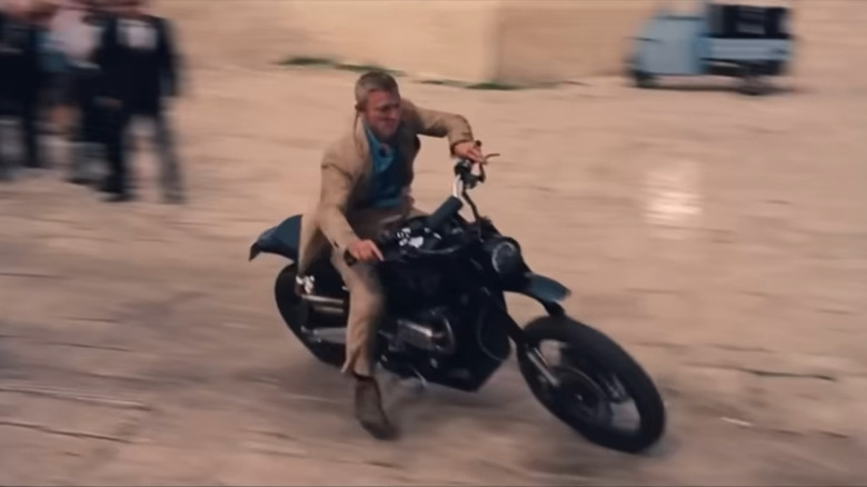 James Bond riding Triumph motorcycle