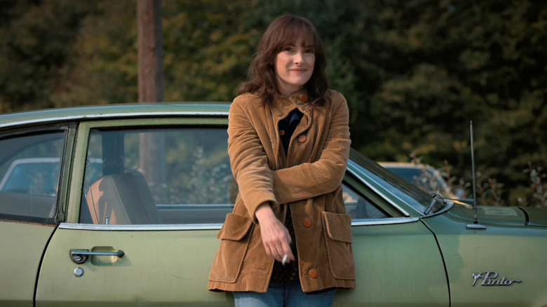 Joyce Byers standing in front of her 1976 Ford Pinto