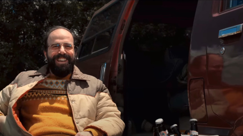 Murray Bauman sitting in front of his 1986 Toyota Cargo Van from Stranger Things