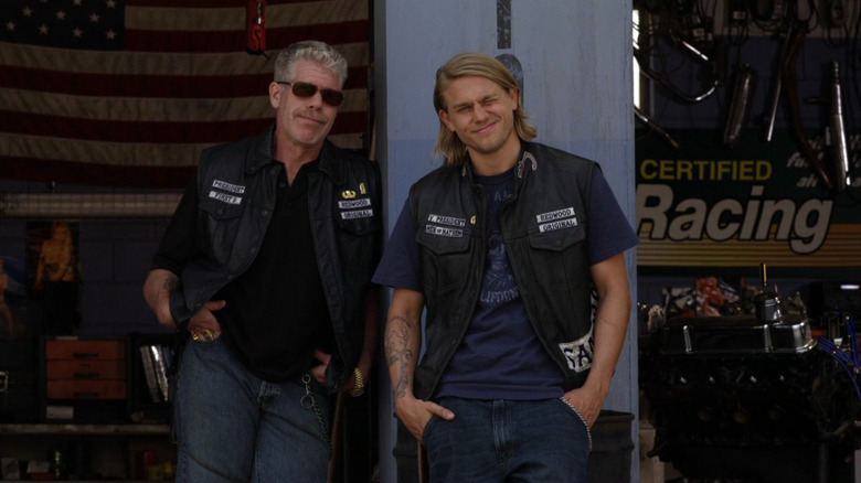 Jax (Charlie Hunnam) and Clay (Ron Pearlman) leaning against shop in Sons of Anarchy