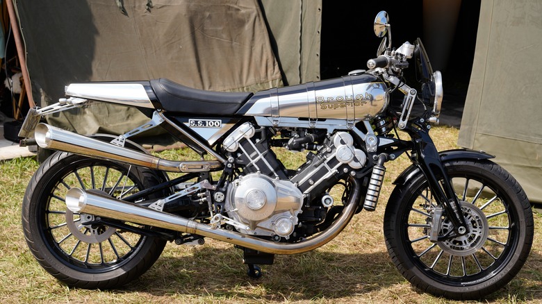 black and chrome Brough Superior SS100 motorcycle parked on grass