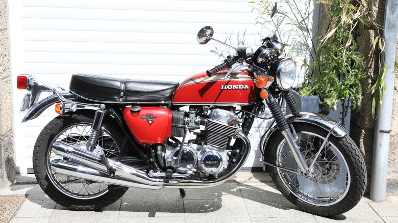 red and black Honda CB750 motorcycle