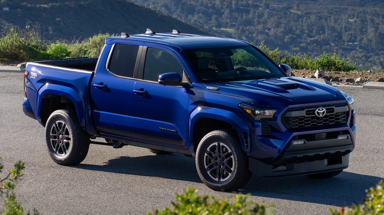 A blue Toyota Tacoma TRD Sport on the road