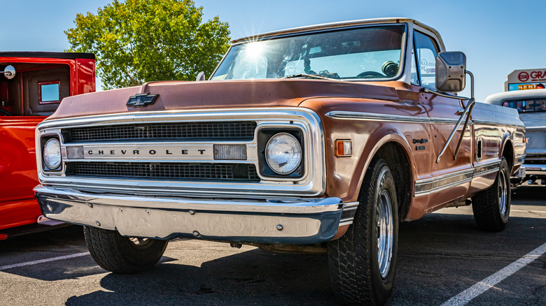 A brown Chevy C20 parked