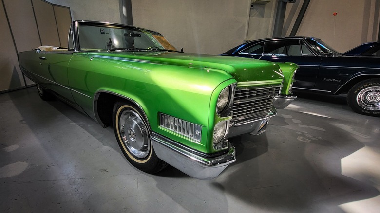 A green 1970 Cadillac in a garage