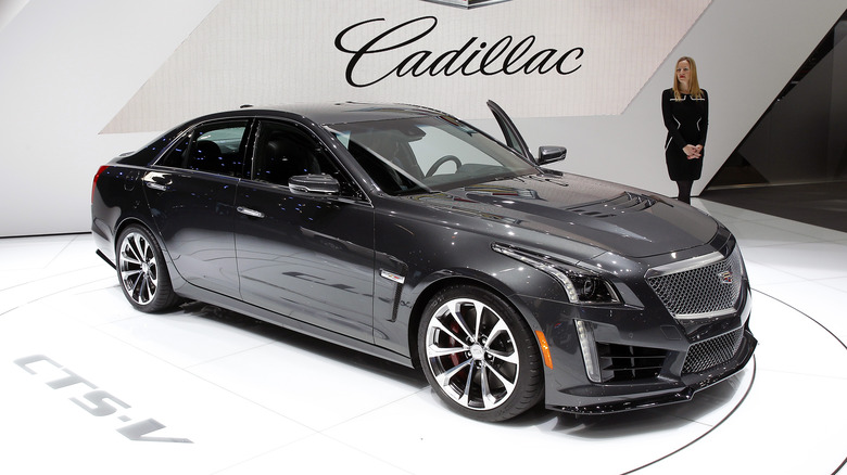 A black Cadillac CT5-V in a showroom