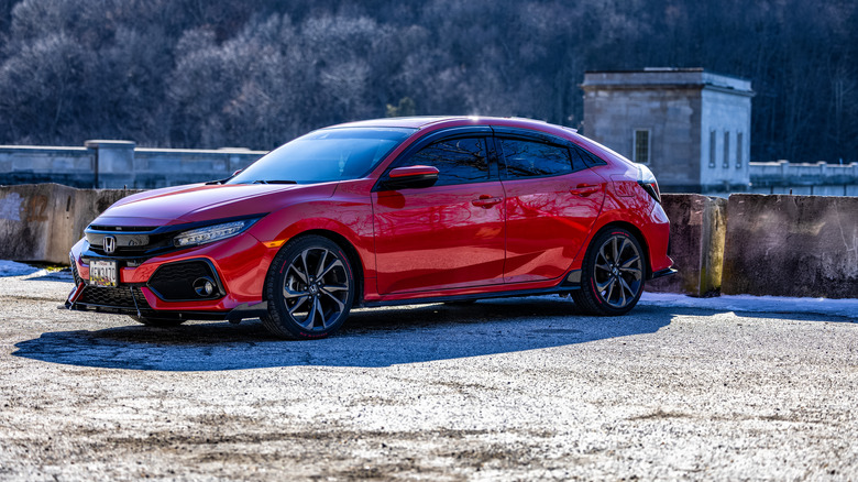 A red Honda Civic parked