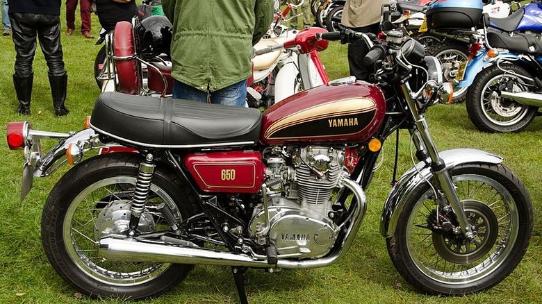 A Yamaha XS650 motorcycle parked on the field