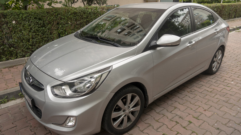 A Hyundai Accent parked near a curb