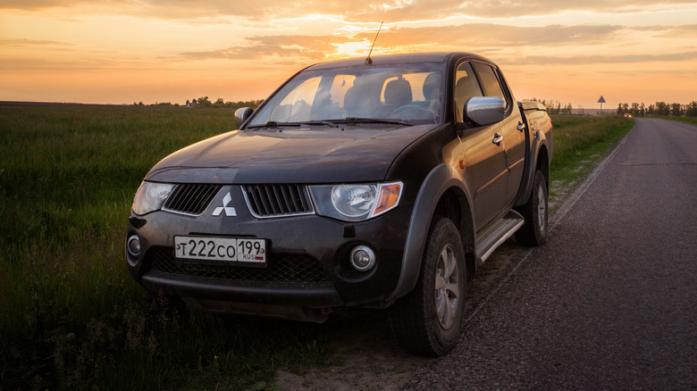 Mitsubishi L200 pickup at sunset