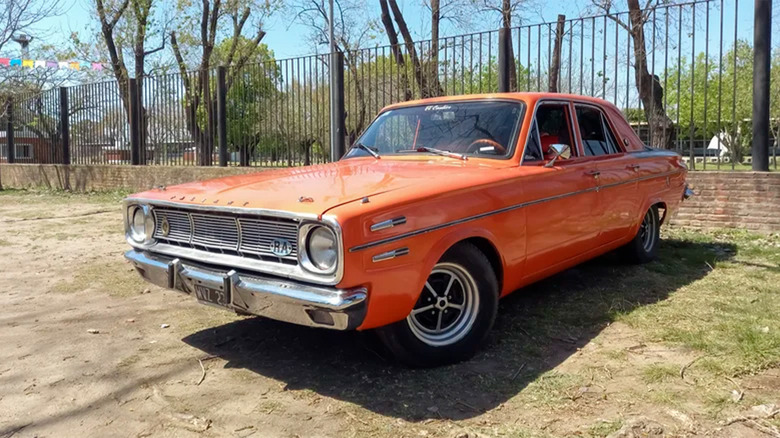 An orange Chrysler parked