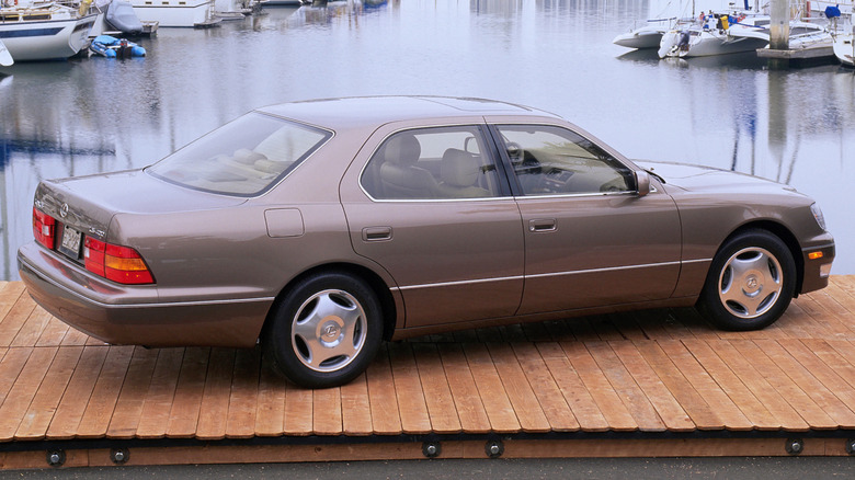 Second-gen 1999 Lexus LS 400 parked on a marina harbor rear 3/4 view