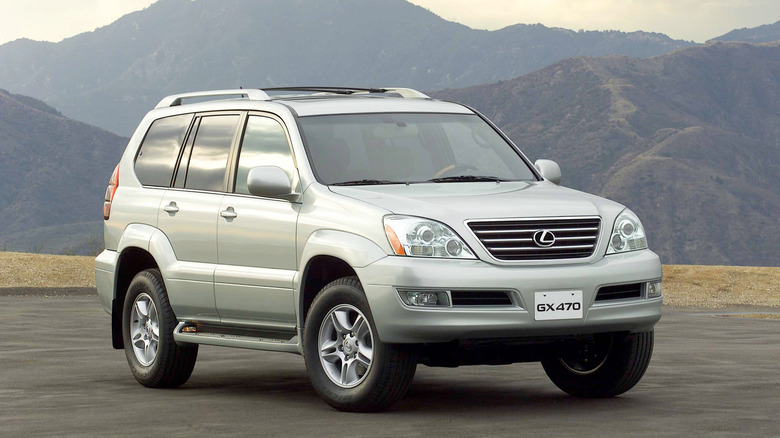 First-gen 2003 Lexus GX 470 front 3/4 view with mountains in the background