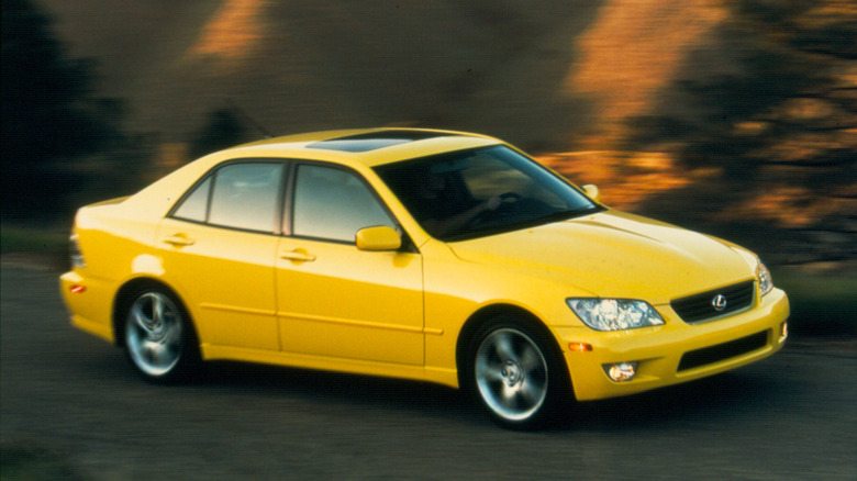 First-gen 2001 Lexus IS 300 cornering at speed front 3/4 view