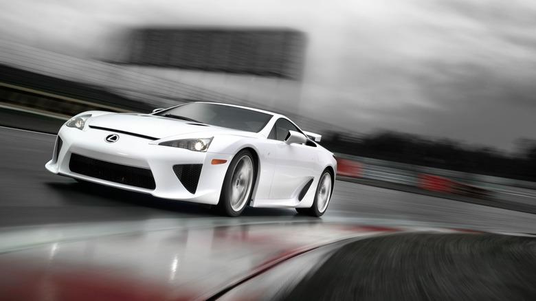 2010 Lexus LFA supercar cornering at speed on a track front 3/4 view